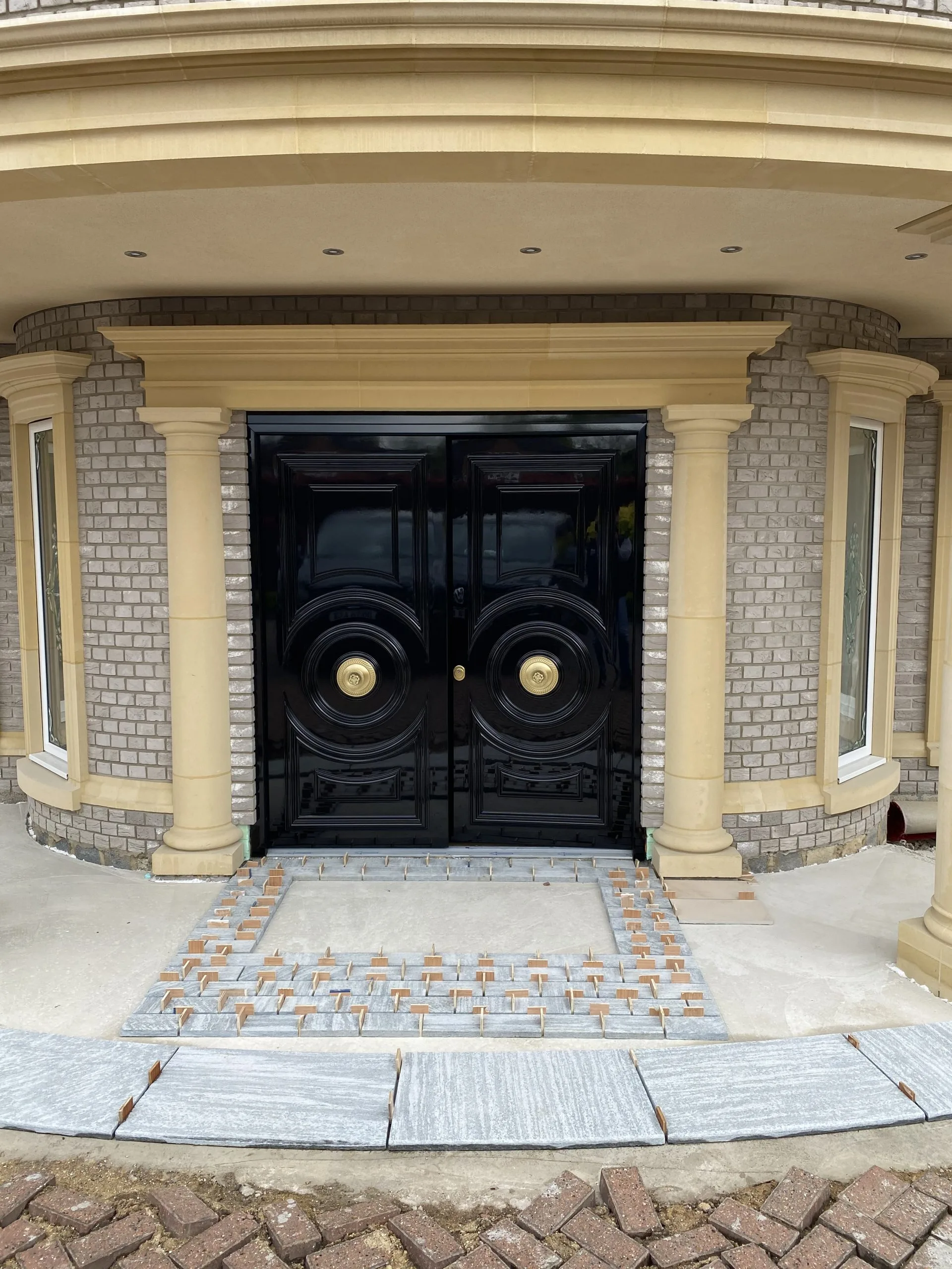 black-security-door-golden-handles