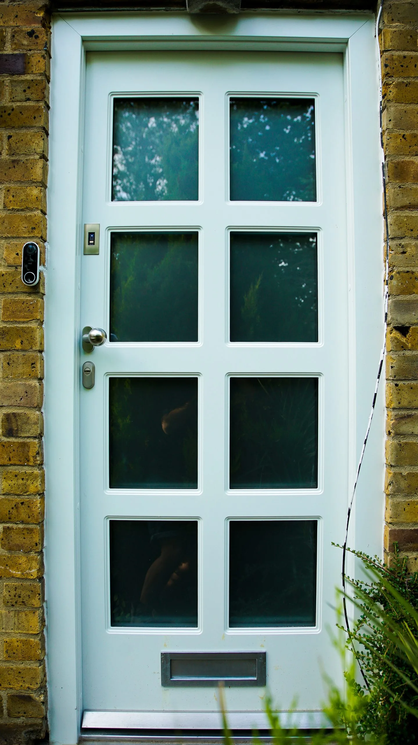 narrow-white-high-security-doors-with-glasses