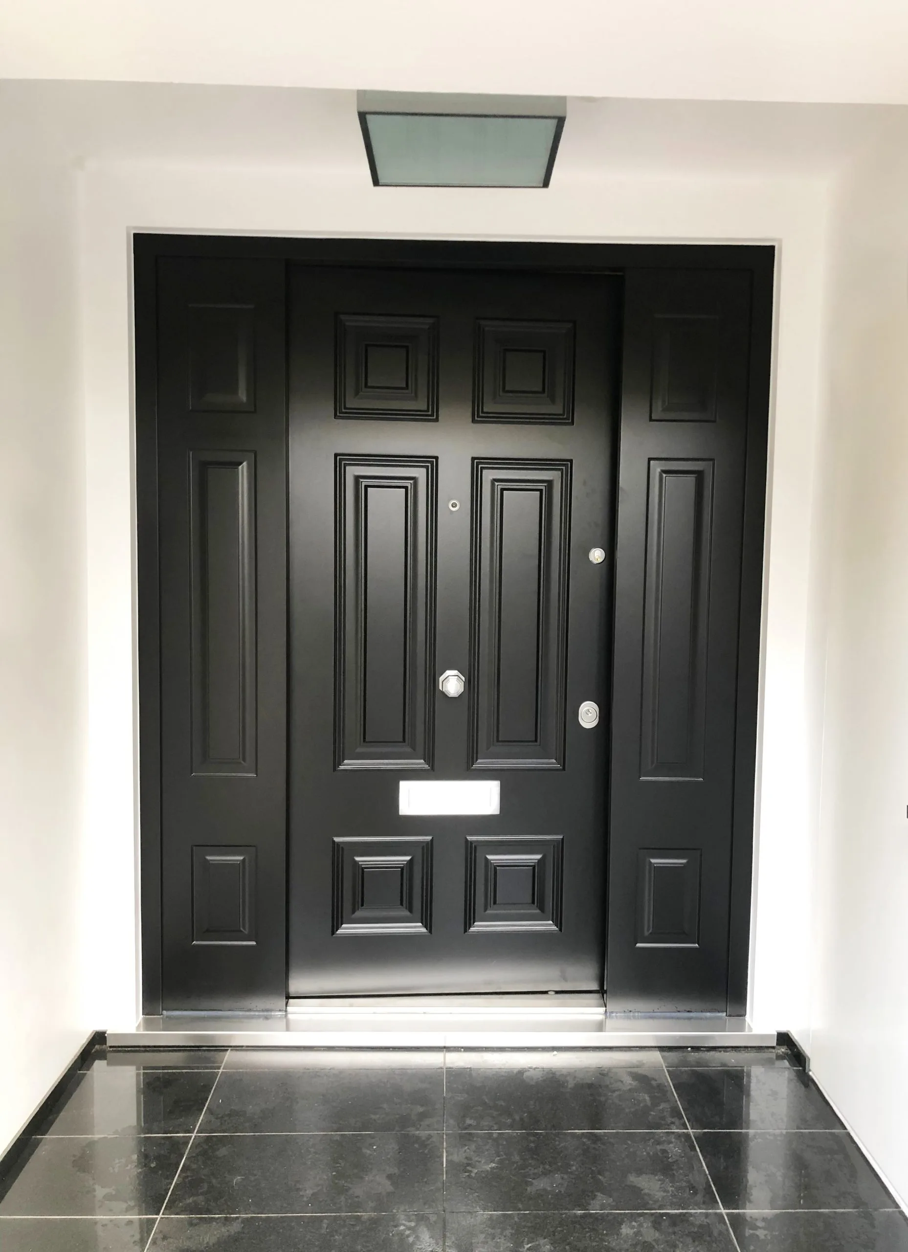 black_door_with_black_panels_outside